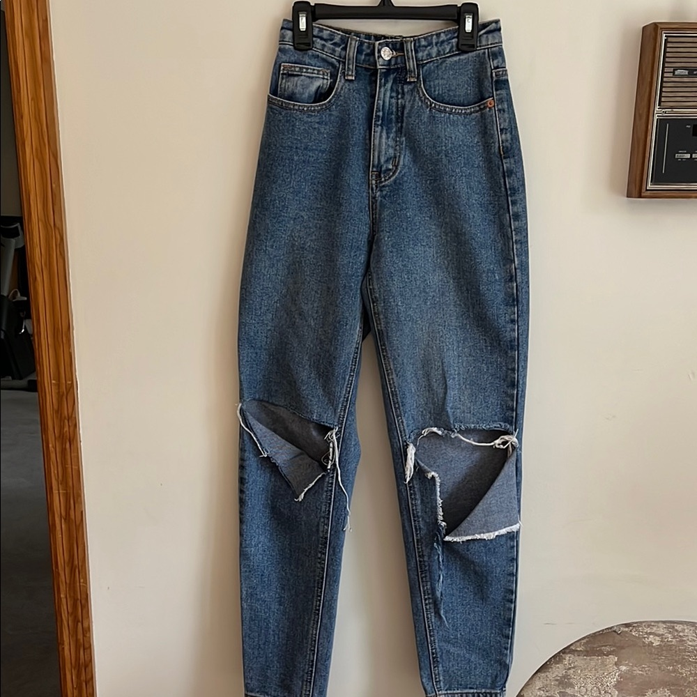 Distressed Blue Jeans with cuts